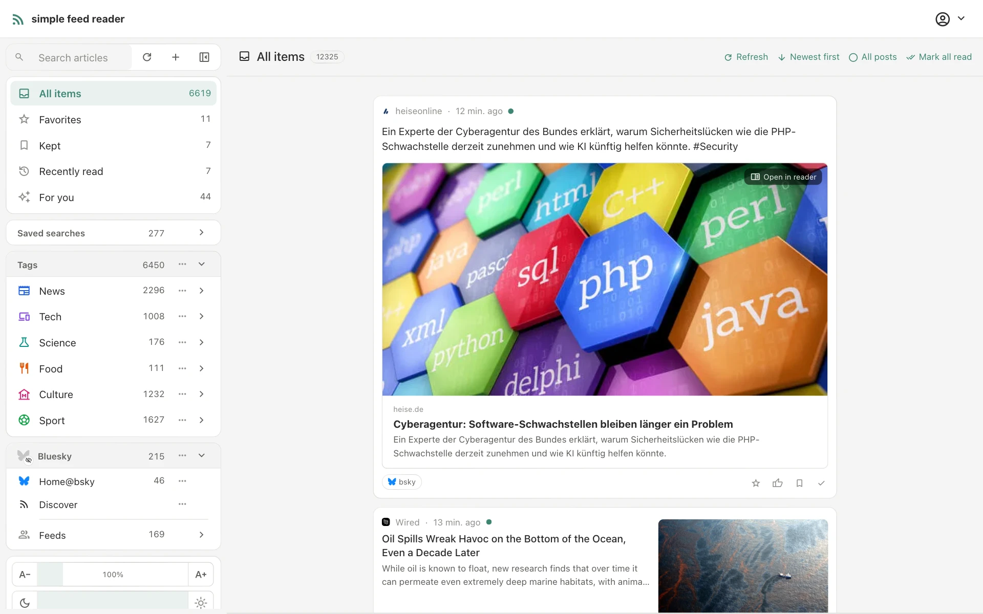 The magazine layout: one reading column of varied cards, with the sidebar of feeds, tags and saved searches